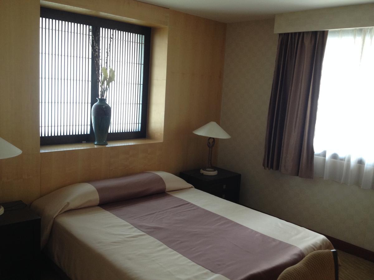 Gardengrove Suites Bangkok Værelse billede